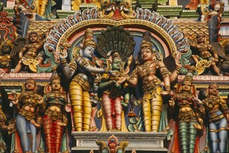 INDIA, Tamil Nadu, Maduarai , Sri Meenakshi Temple detail of multicoloured carvings