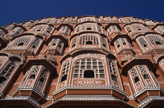 INDIA, Rajasthan, Jaipur, Palace of the Winds aka Hawa Mahal. View looking up the pink and white