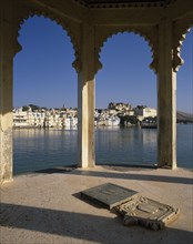 INDIA, Rajasthan, Udaipur, City Palace arches-view through to Lake Palace