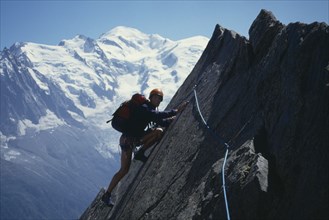 10032549 SPORT  Mountaineering Climbing slab pitch La Chappelle de la Guere Aiguilles Rouges Massif in the French Alpes.