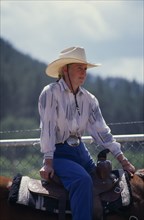 USA, South Dakota, Deadwood, Cowgirl sitting on horse at the Days Of 76 rodeo