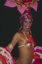 CUBA, Havana Province, Havana, Tropicana Club female dancer in pink costume