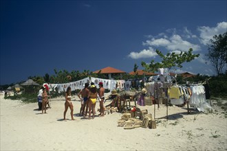 WEST INDIES, Jamaica, Negril, Stall on beach selling T-shirts and tourist goods.