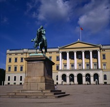NORWAY,  , Oslo, Royal Palace exterior with statue in foreground