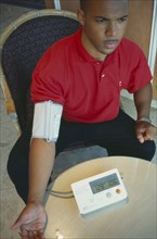 HEALTH, Blood Pressure, Digital Blood Pressure machine with BP reading on the left and pulse