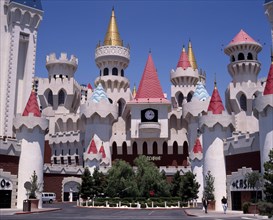 USA, Nevada, Las Vegas, Excalibur Hotel and Casino. Chateau facade of hotel entrance with pink and
