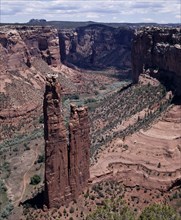 USA, Arizona, Canyon de Chelly, View looking down to Spider Rock with canyon beyond and scree