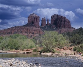 USA, Arizona, Sedona, Cathedral Rock in Oak Creek Canyon. View over river to wind eroded rock