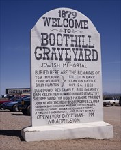 USA, Arizona, Tombstone, Boothill Graveyard. Large stone sign in shape of gravestone listing the