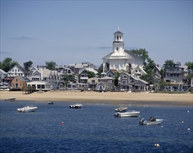 USA, Massachusetts, Cape Cod, Provincetown. The beach with houses along the sand and small boats at