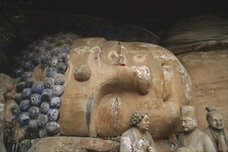 CHINA, Sichuan, Baoding, Tang Dynasty reclining sleeping Buddha depicting the state of achieving