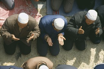 CHINA, Gansu Province, Lanzhou, View over heads of Muslims praying