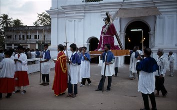 INDIA, Goa, Margao, Easter procession with people carrying a statue of Christ from the church