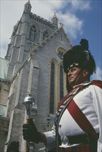 BERMUDA, Hamilton, Pipe band Major in front of the Cathedral
