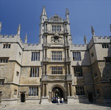 ENGLAND, Oxfordshire, Oxford, The Old Bodleian Library exterior facade with people walking through