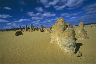 AUSTRALIA, Western Australia, Nambung National Park,  Rock pinnacles in desert landscape.