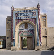 UZBEKISTAN,   , Bukhara, The Summer Palace. The entrance gate with vivid mosaics and wooden door