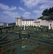 FRANCE, Indre Loire, Villandry, View across gardens to chateau with blue and cloudy sky.