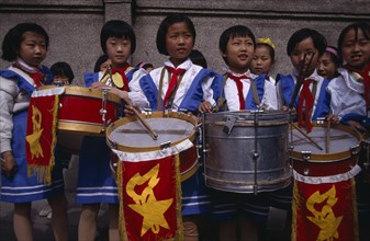CHINA, Xining, Girls playing drums in school band