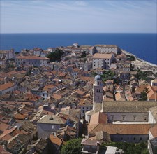 CROATIA, Dubrovnik, View over rooftops towards sea.