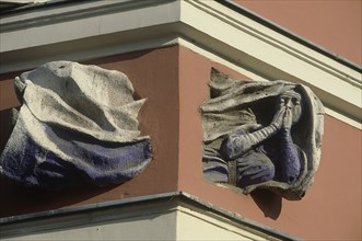 HUNGARY, Budapest, Building detail showing a flying nun passing through the corner of a building