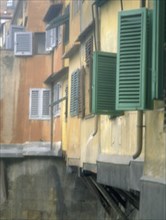ITALY, Tuscany, Florence, Shutters on houses on  the Ponte Vecchio over the River Arno