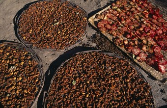 PAKISTAN, Hunza, Karimabad, Sun dried tomatoes and apricots.