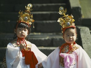JAPAN, Honshu, Kyoto, Two young girls in costume at the Jidai Matsuri Festival Of Ages in the Gosho
