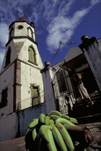 WEST INDIES, Dominica, Roseau, The Methodist Church with Harvest Festival Offering of bananas on