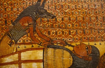 EGYPT, Cairo, Painting on wooden coffin. Jackal Headed God Anubis over reclining figure