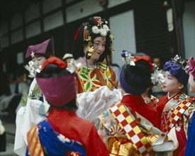 JAPAN, Honshu, Kyoto, The maiden with young boys at the Tanabata Festival