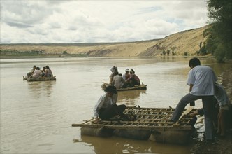 CHINA, Yellow River, People traveling down river on Hide Raft