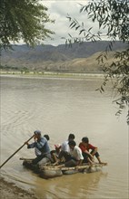 CHINA, Yellow River, People traveling off on a Hide Raft
