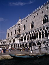 ITALY, Veneto, Venice, Doges Palace aka Palazzo Ducale exterior with moored gondola in the