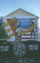IRELAND, North, Belfast, Saoirse Mural on gable wall in Falls Road next to Dunville Park.
