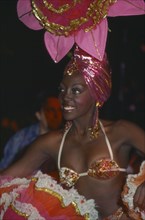 CUBA, Havana Province, Havana, Tropicana Club female dancer in pink costume