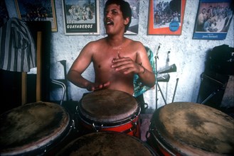 CUBA, Havana, Musician playing Bongo Drums