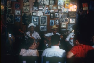 CUBA, Santiago, Troubadors Home.  Interior and musicians.