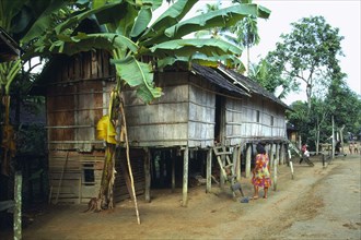 INDONESIA, Borneo, Kalimantan, Dayak Longhouse in village