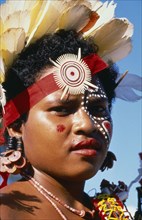 PAPUA NEW GUINEA, Trobriand Islands, Portrait of girl in traditonal costume at the fifth Pacific