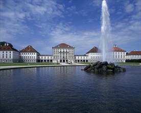 GERMANY, BAVARIA , Munich, Nymphenberg Palace. Ornamental lake with rock fountain and tall water