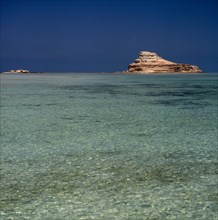 UAE, Abu Dhabi, "Nr Ruwais, Az Zabbut small rocky island surrounded by  clear turquoise sea with
