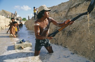 MEXICO, Quintana Roo, Playa del Carmen, Men digging sewers with shovels