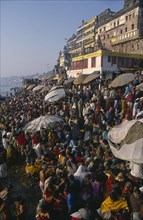 INDIA, Uttar Pradesh, Varanasi, Sivaratri Festival crowds beside the River Ganges.