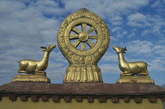 TIBET, Lhasa, Jokhang Temple, Golden Wheel of Dharma on the roof