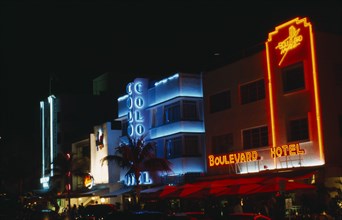 USA, Florida, Miami Beach,  Ocean Drive Art Deco hotels illuminated at night