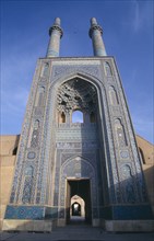 IRAN, Yazd, Friday mosque or Masjed e Jame mosque. Ornate entrance archway and twin towers
