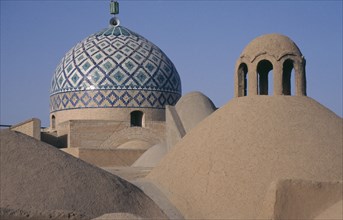 IRAN, Yazd, View over rooftops and dome of the Old city Mosque