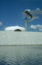 BRAZIL, Federal District, Brasilia, Kubitschek Memorial with large sculpture holding a statue seen