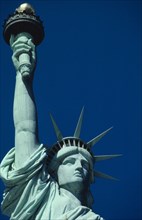 USA, New York State, New York, Statue of Liberty. Close up view of the head and raised arm against